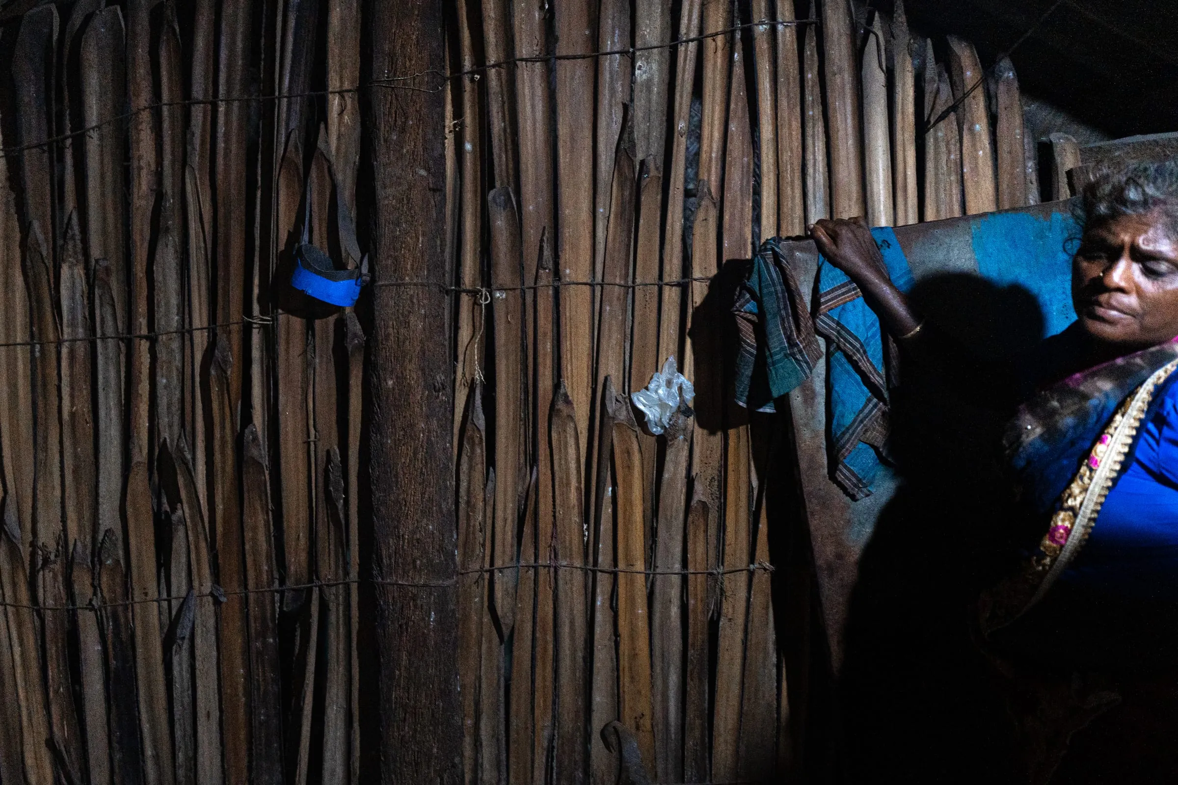 Diving gear hangs on the wall of Bagvati’s kitchen in a coastal village near Rameswaram. She began seaweed harvesting at 25, after years as a homemaker. Like many women divers, she uses simple, often second-hand equipment—masks and sacks tied to their waists—to collect seaweed from shallow waters.