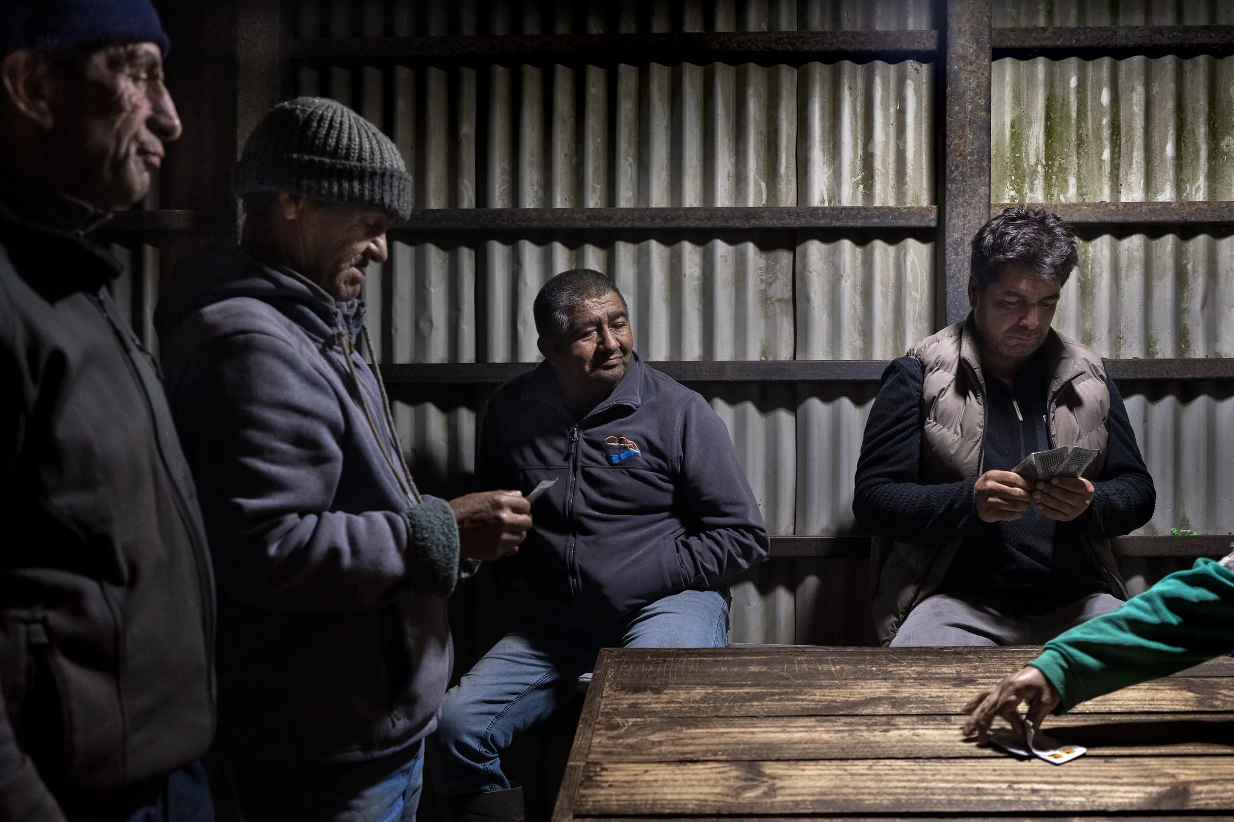 Luis Troncoso, 56, plays with his colleagues, all members of the pelillo harvesters’ union. Winter is a low-yield season with little harvesting activity. During this time, algueros (seaweed harvesters) plant Pelillo, which begins to be collected in the spring months, starting in August. Amortajado, Los Lagos Region, Chile.